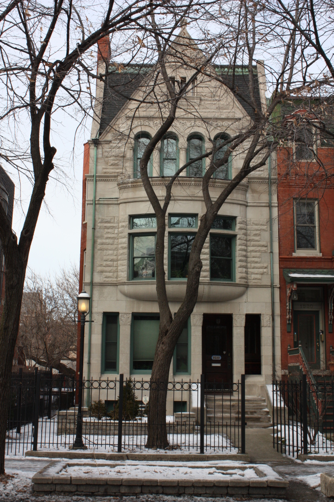 Richard Norman Foster House at 1532 W Jackson Blvd is a limestone Romanesque townhouse built in 1892 by Patton and Fisher.