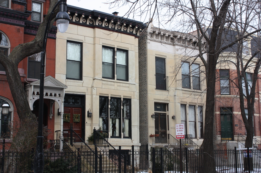 In 1884 Edward Baumann designed this double-house at 1506 and 1508 W Jackson for himself in Marble front Italianate style.