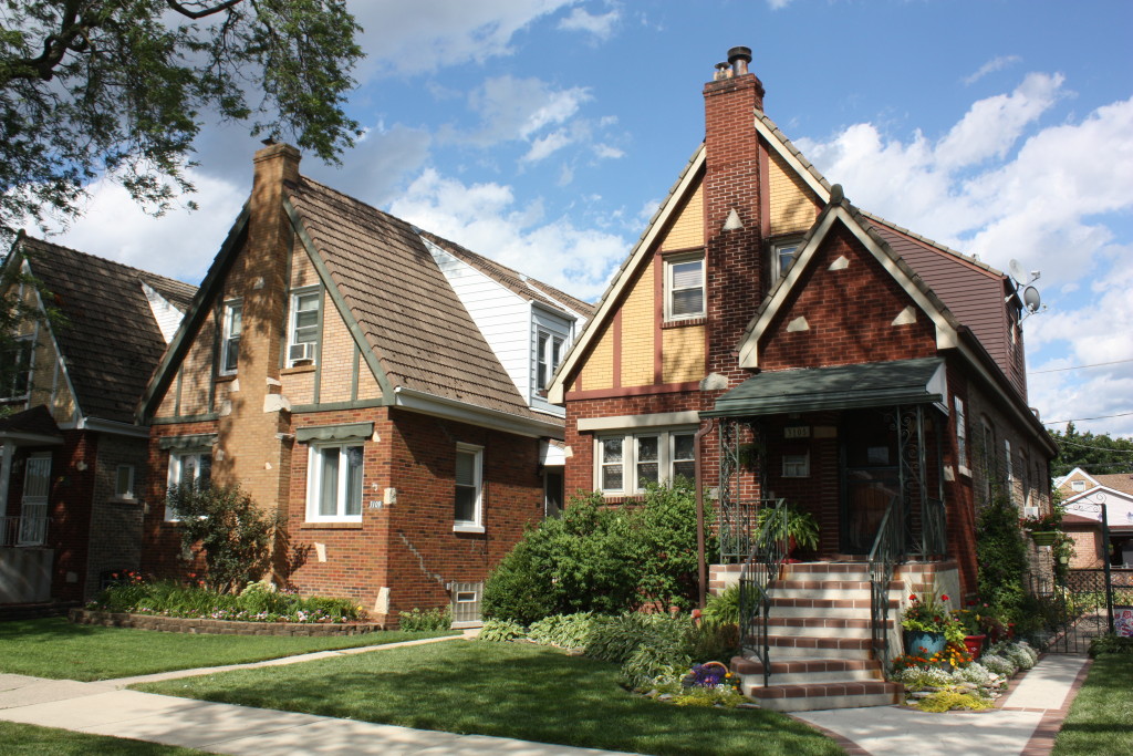 Handsom Tudor neighbors at 3105 and 3109 N Rutherford